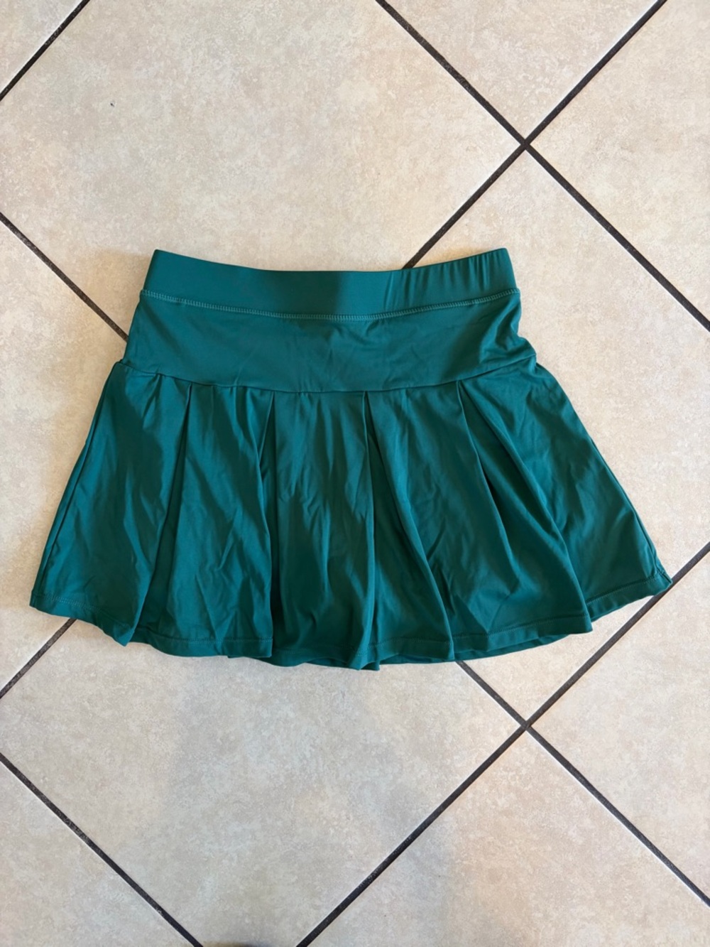 gold hinge forest green pleated skirt